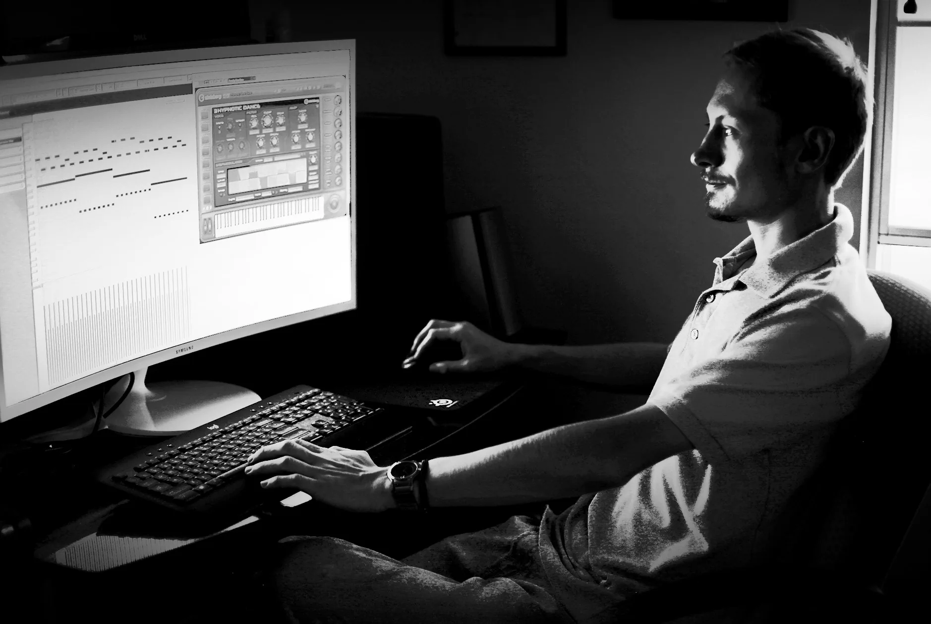 High-contrast black-and-white portrait of Ryan working in Cubase