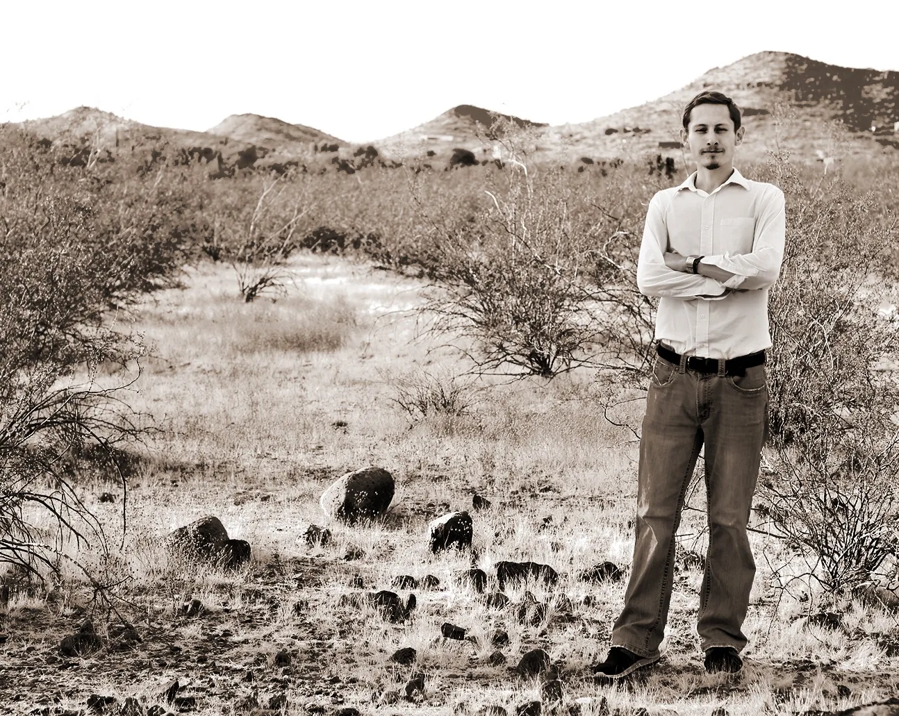 Sepia-toned full-body desert portrait of Ryan